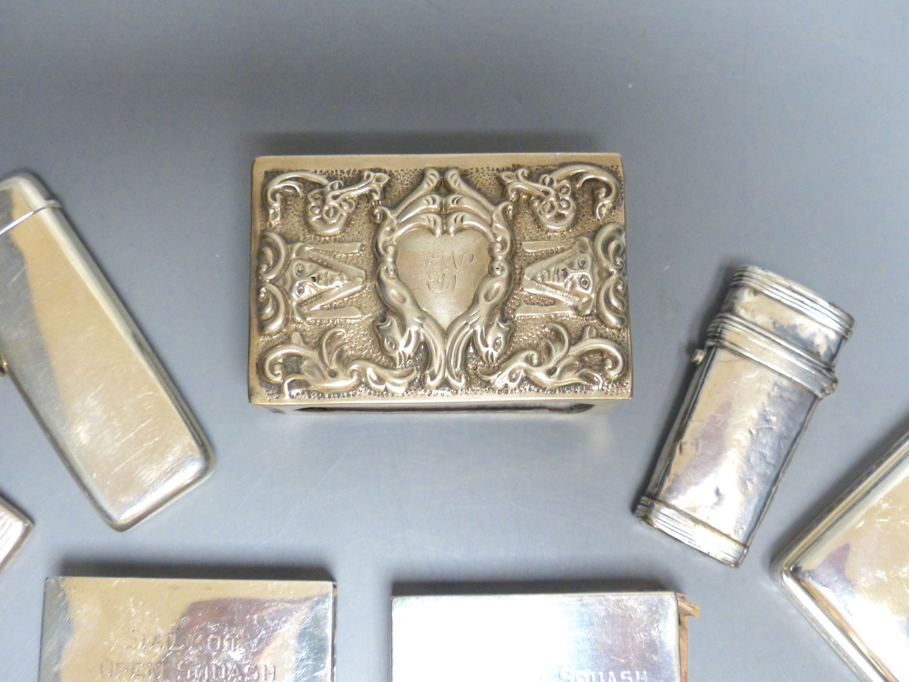 Two late Victorian silver diary cases, largest 85mm and seven other items including silver match sleeves & a silver fleam case.